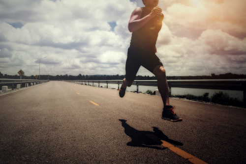 Sport man with runner on the street be running for exercise.